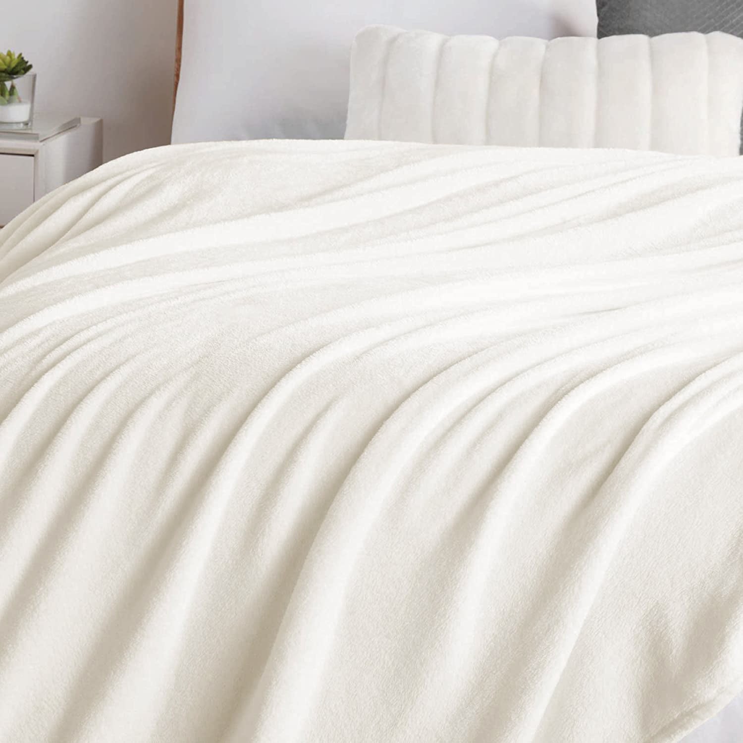 "Soft cream white fleece sofa throw blanket. Cozy and stylish. Perfect for snuggling. High-quality material. Available now at our e-commerce store." best sofa throw blankets in ireland