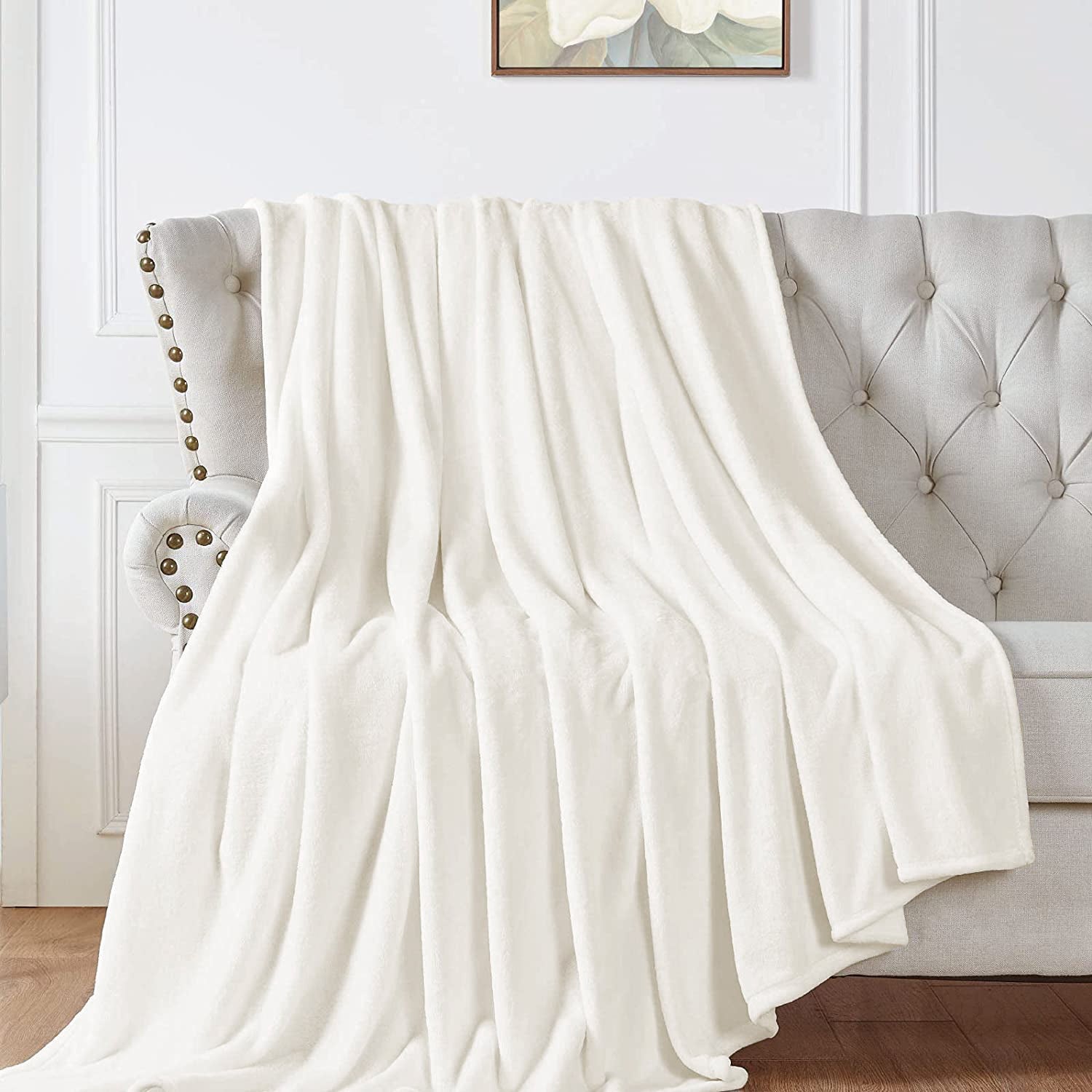 "Soft cream white fleece sofa throw blanket. Cozy and stylish. Perfect for snuggling. High-quality material. Available now at our e-commerce store." best sofa throw blankets in ireland