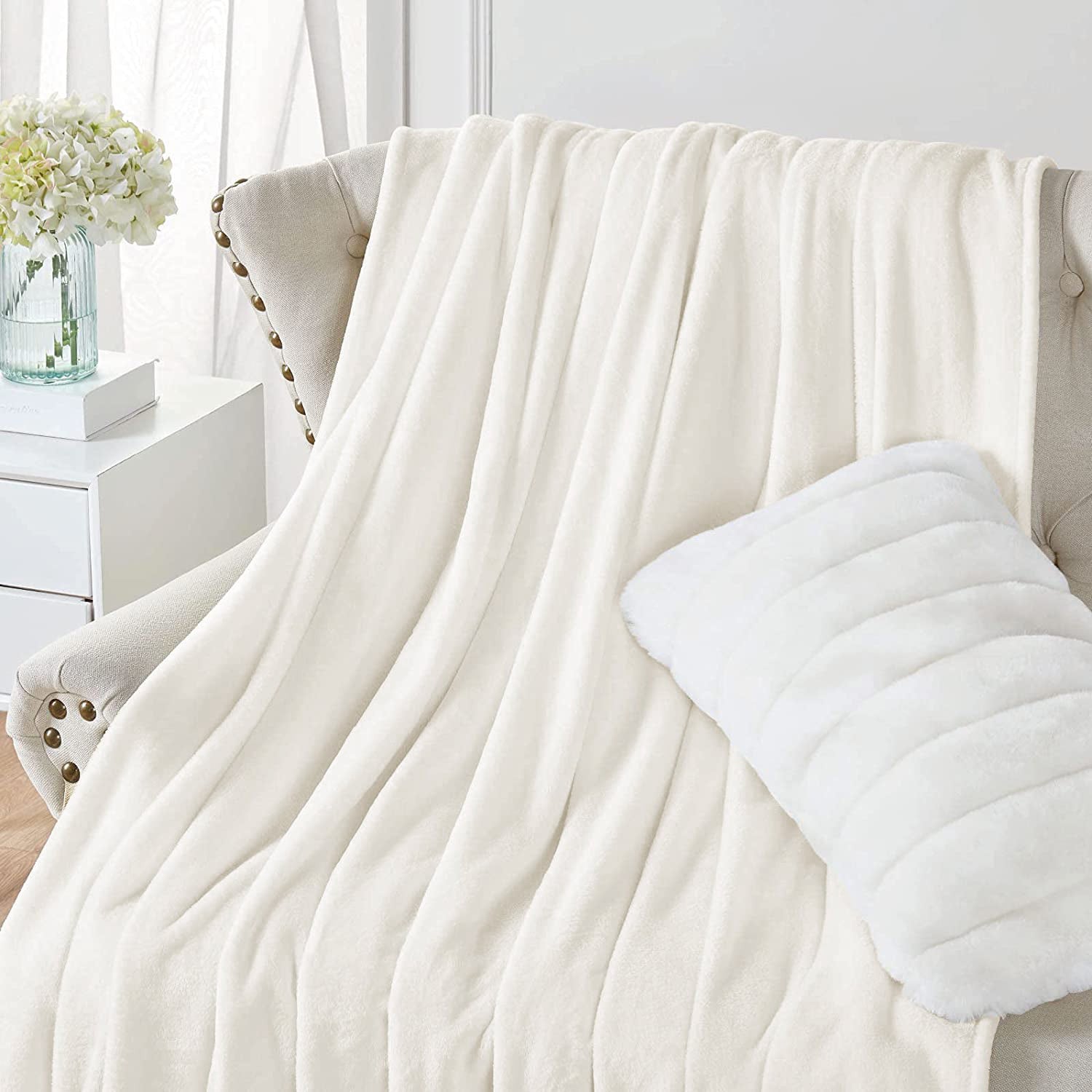 "Soft cream white fleece sofa throw blanket. Cozy and stylish. Perfect for snuggling. High-quality material. Available now at our e-commerce store." best sofa throw blankets in ireland